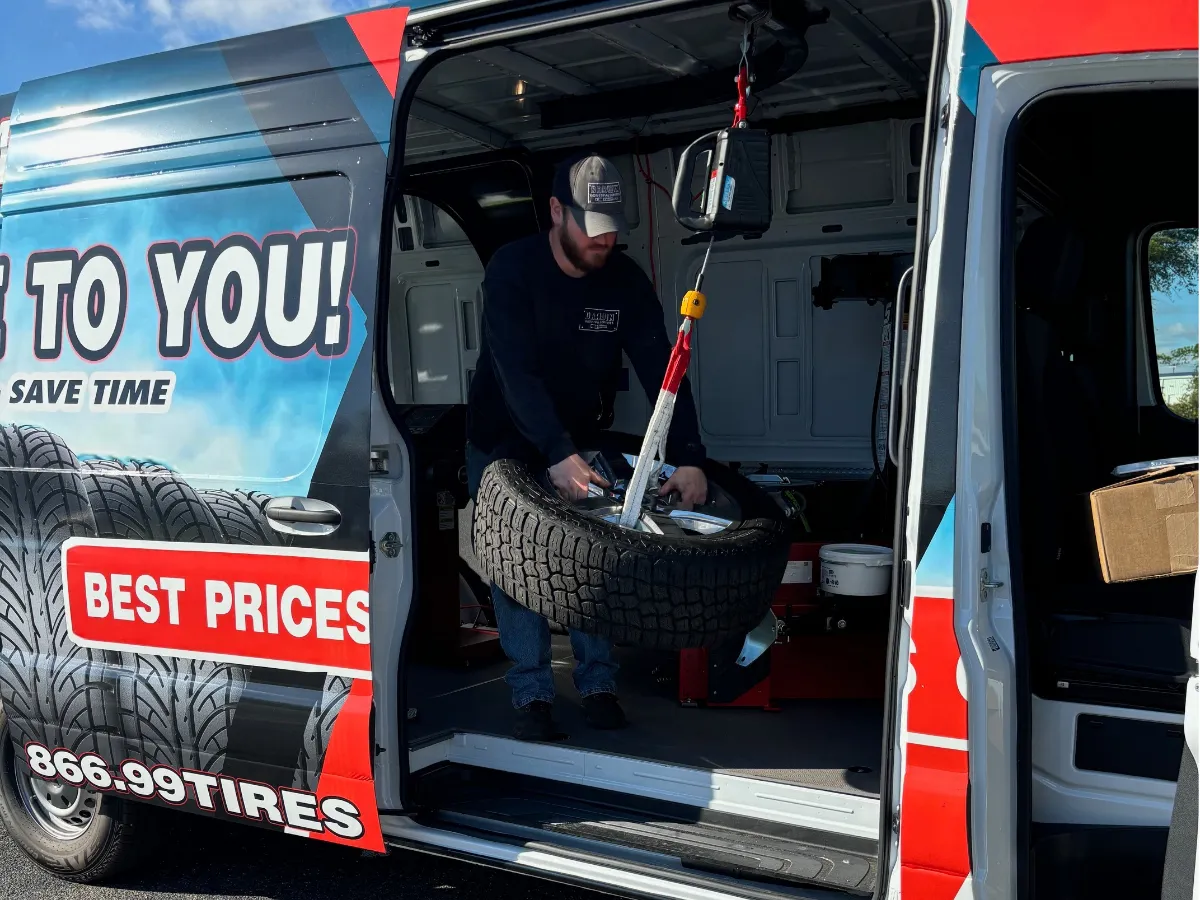 Technician mounting a tire from the mobile service van in Memphis