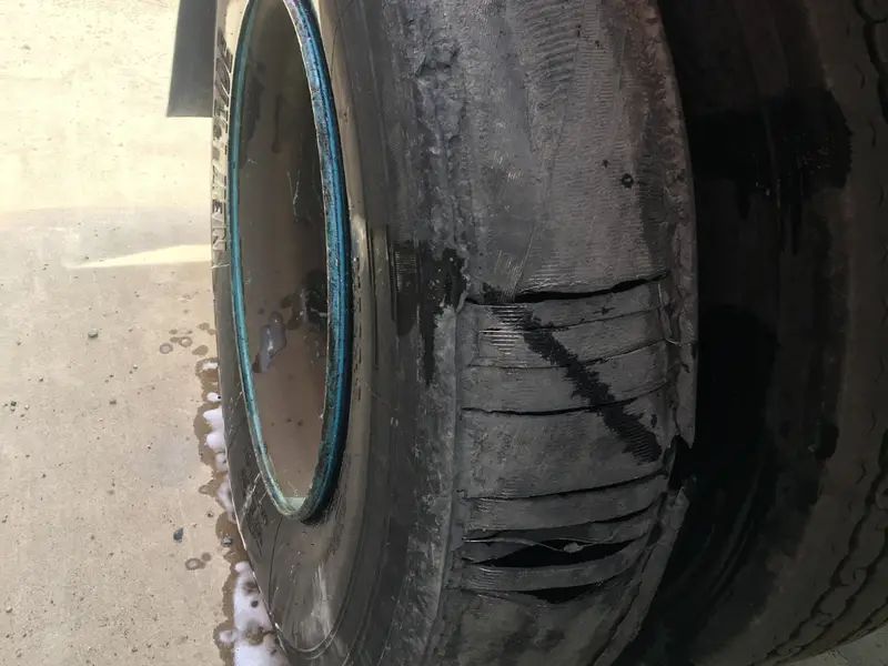Emergency semi truck tire blowout requiring immediate roadside assistance